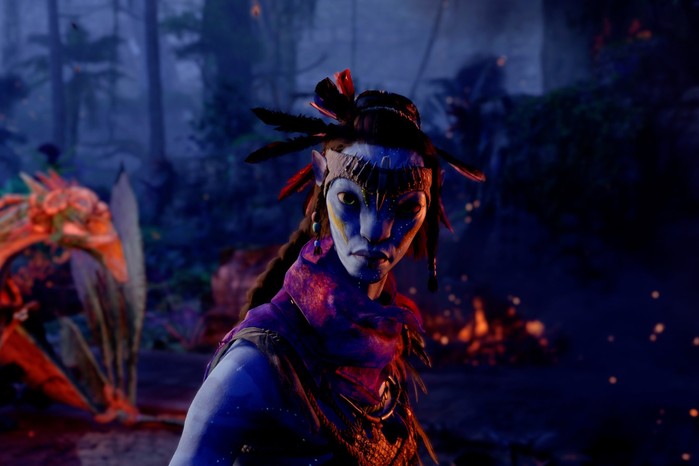 Avatar Frontiers of Pandora: an Avatar character standing in a wooded area, looking into camera